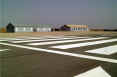 The hangar at Kingsfield which the Herc tried to demolish photographed in 2002 with the repair patches still visible. The Hanger is still used by The Crusaders Gliding Club.