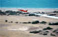 Reds over Curium Beach.